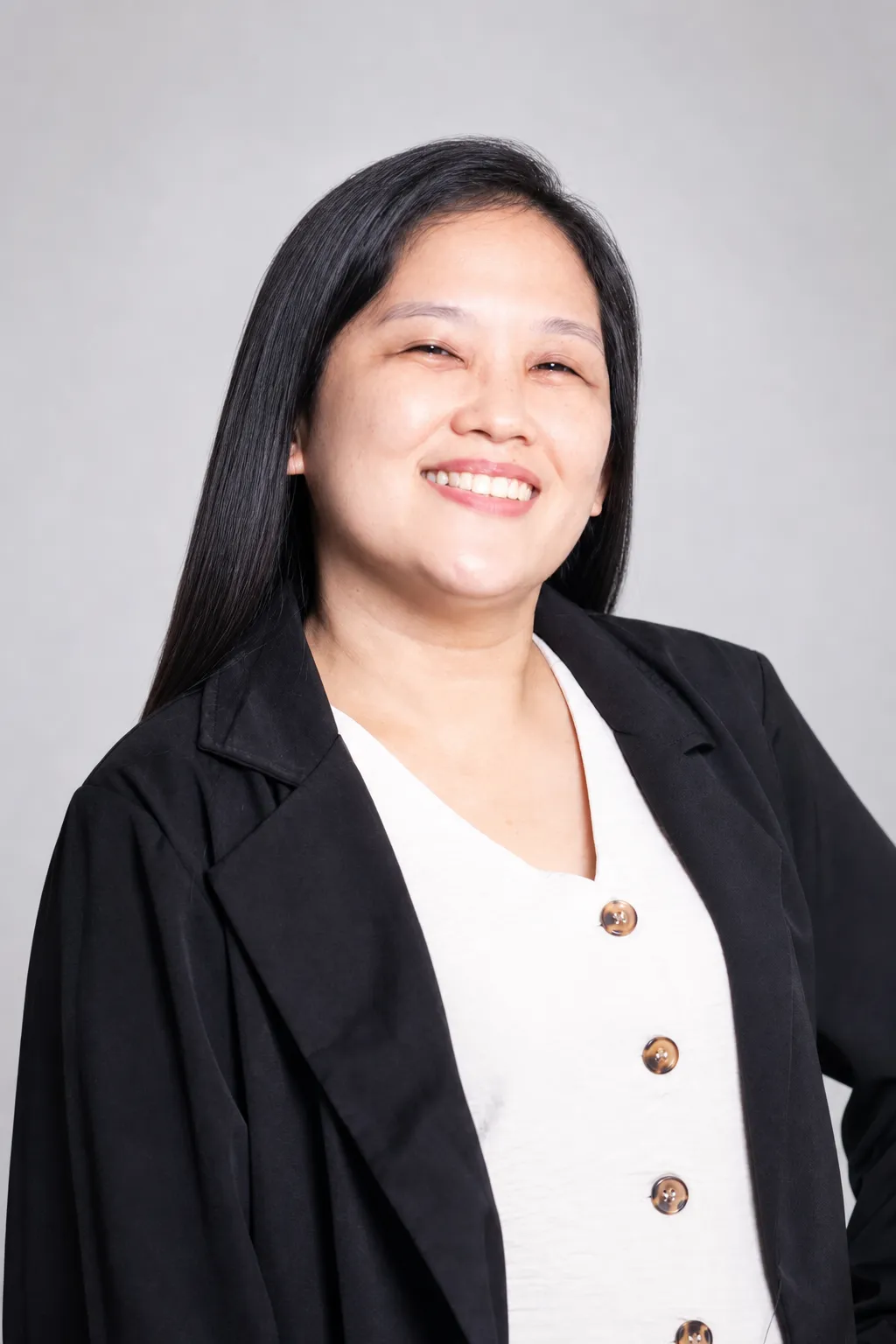 Analyn Alforque, smiling professional headshot in a black blazer